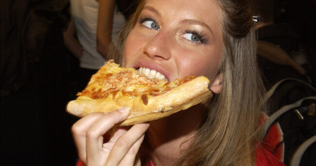 Gisele Bundchen backstage eating pizza in the hair and makeup room