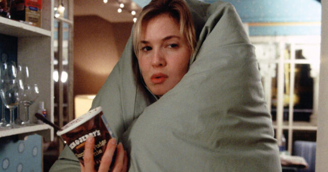 bridget jones scene of her eating ice cream with a duvet around her body