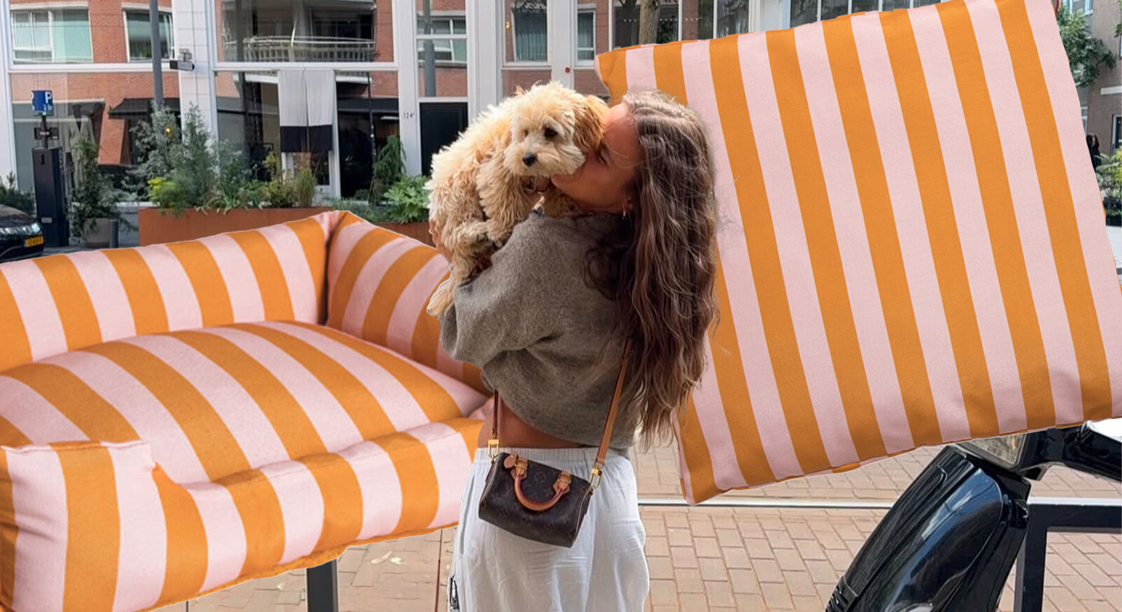 Nina Housten with her little dog, posing outside with striped orange accessories