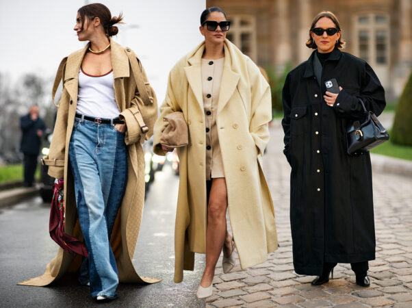 Drie vrouwen in lange, oversized trenchcoats en jassen. Links een vrouw in een lange beige trenchcoat over een wit topje en spijkerbroek. Midden een vrouw in een lange, crèmekleurige wollen jas over een lichte jurk. Rechts een vrouw in een oversized zwarte lange jas.