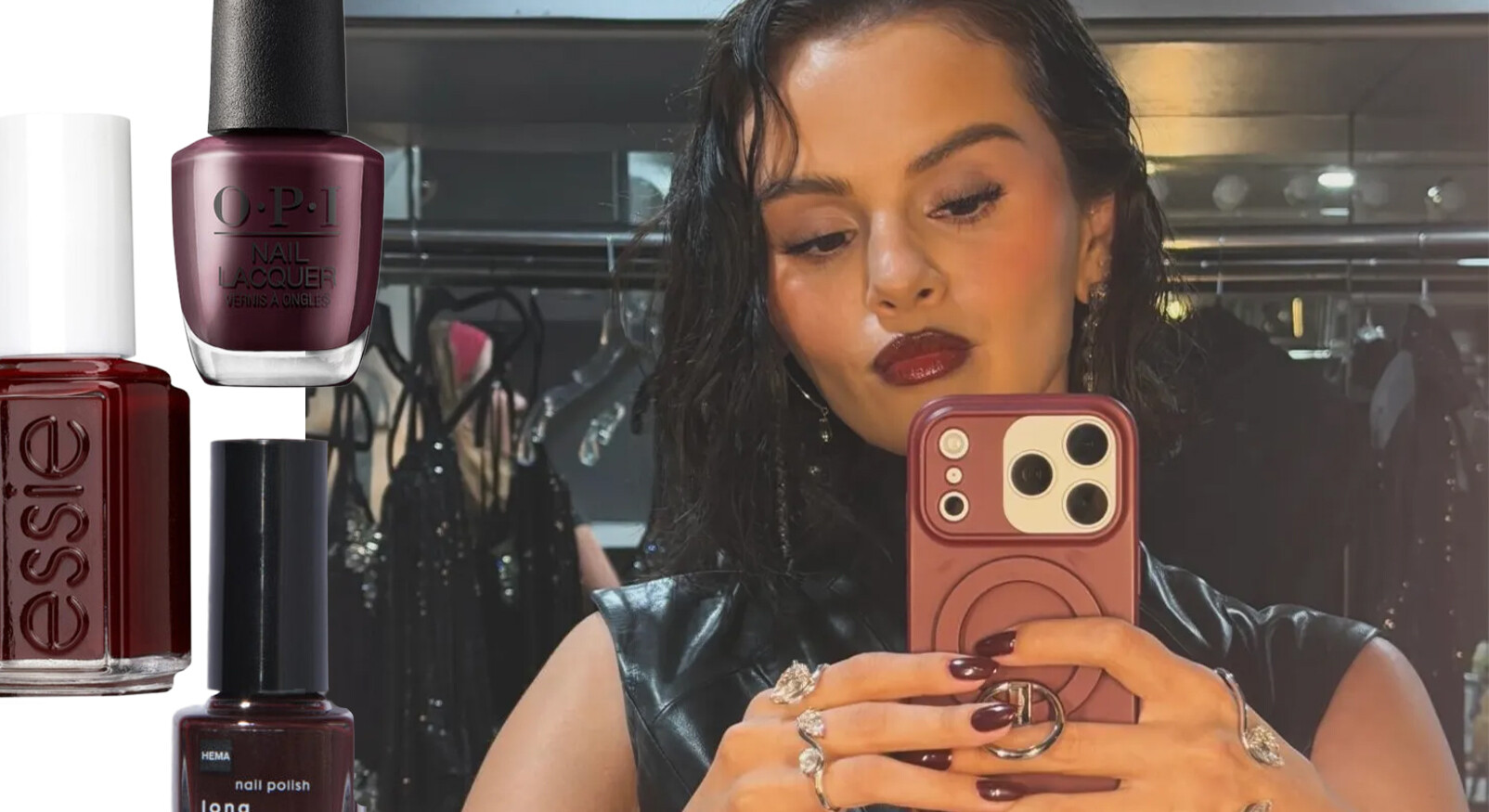 A collage with a close-up selfie of Selena Gomez on the right. She has dark brown hair, makeup with a striking, deep red lipstick, and wears a black leather top. She holds a smartphone in a burgundy case, with a reflection of the surroundings in the screen. Her nails are painted in a dark, deep red burgundy color, matching her lipstick. To the left of the selfie are three bottles of nail polish from different brands (Essie, OPI, and HEMA), all in a deep, dark red burgundy/aubergine shade. The title of the image is "The nail polish color of the month November."