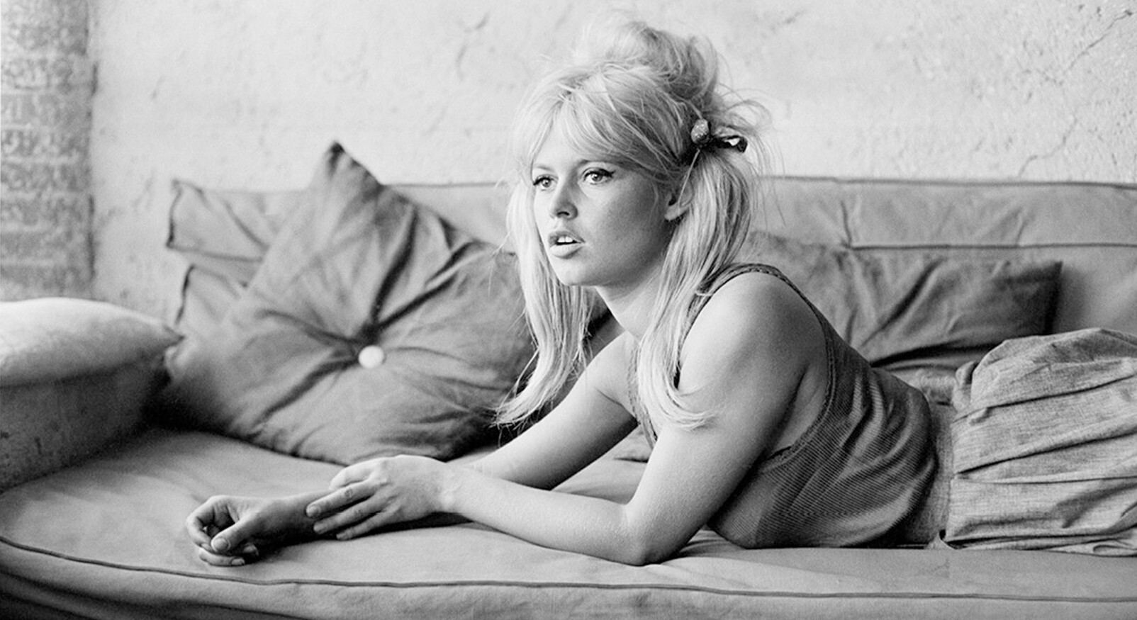 Portrait of style icon Brigitte Bardot with 60s eyeliner and voluminous hairdo, matching French fashion and beauty classes.