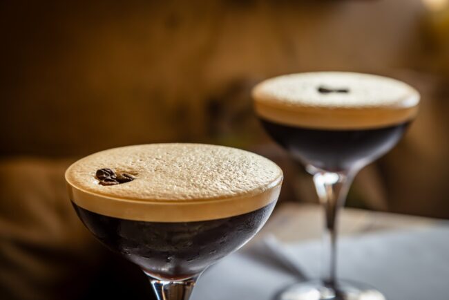 Espresso martinis with coffee beans as decoration, with a shallow depth of field
