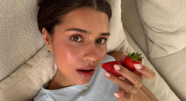 Girl eating strawberries