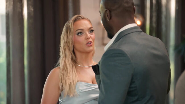 woman looks at a man not so happily 