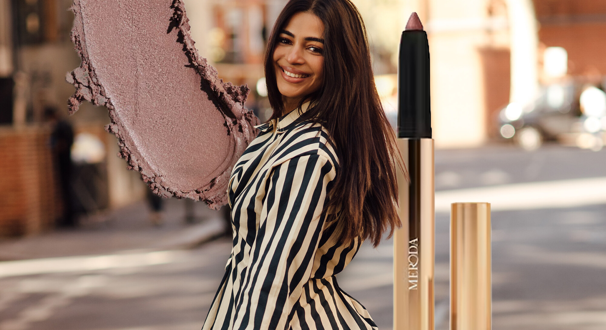 Model with Meroda Eye Perfecting Shimmer Stick and pink shimmer eyeshadow