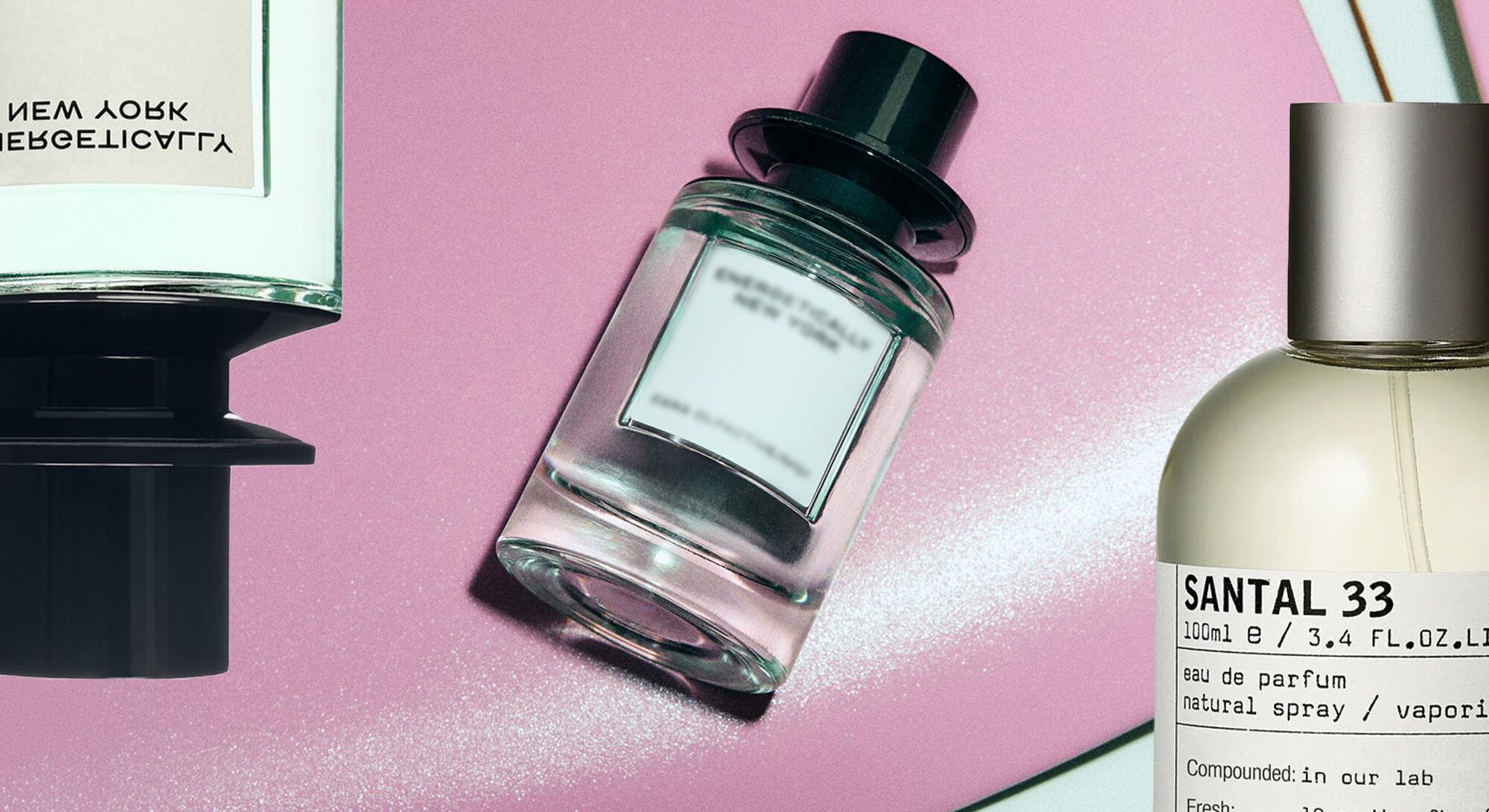 Perfume bottles on a pink background with a bottle of Le Labo Santal 33 on the right and a similar scent as an affordable alternative next to it.