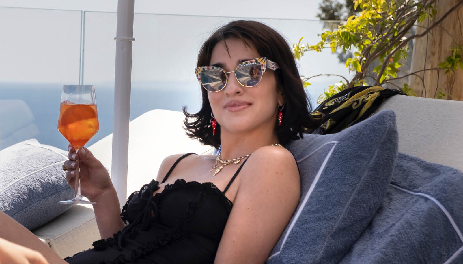 woman aperol cocktail sunglasses