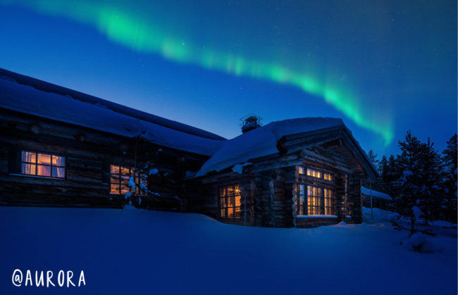 images from Finland with the Northern Lights and small houses to stay in and lots of snow